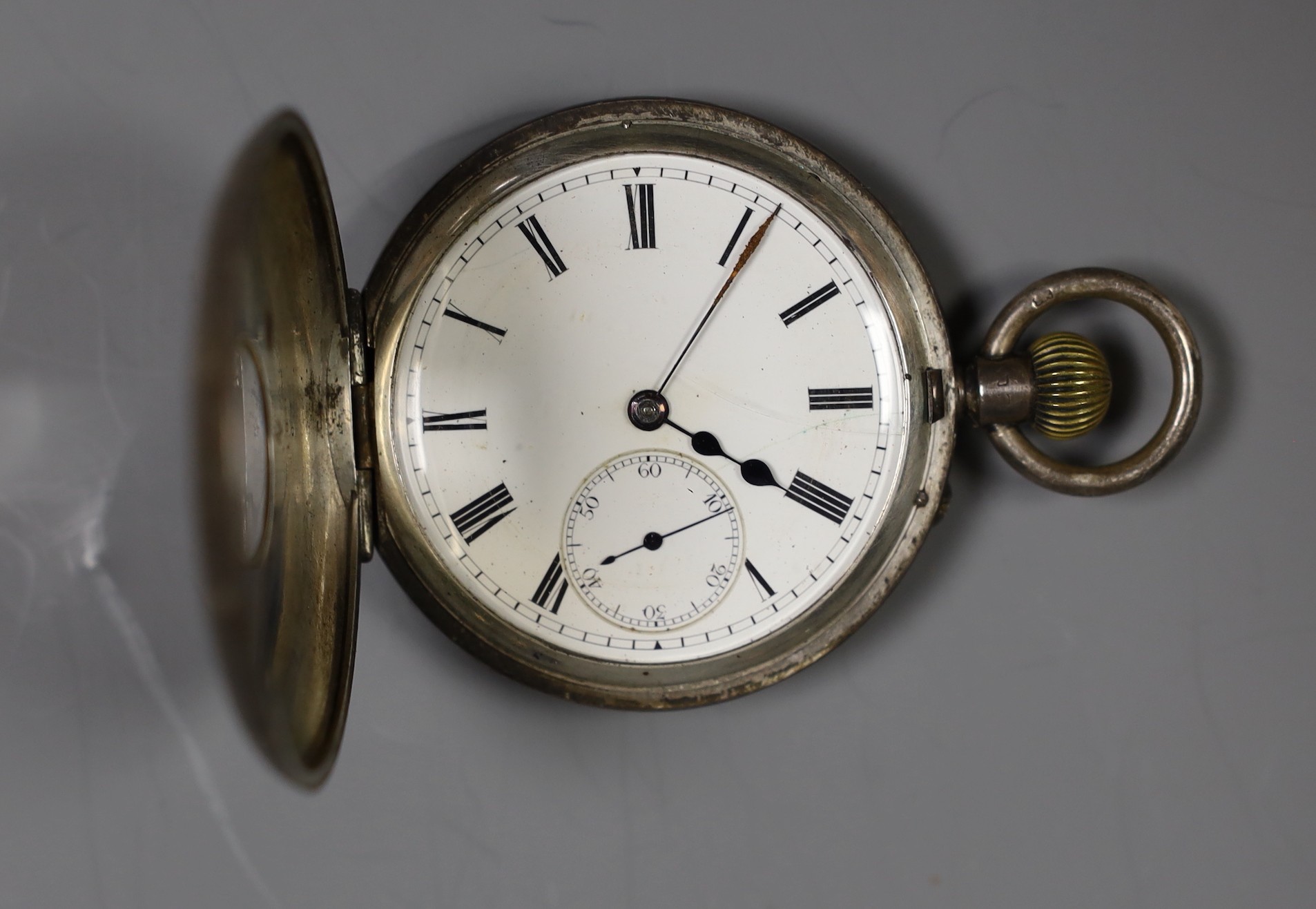 Two silver pocket watches including half hunter and one other white metal open faced pocket watch(lacking glass).